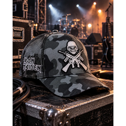 Casquette Iron Maiden camouflage avec motif Eddie brodé A Matter of Life and Death, présentée dans un décor de scène | Iron Maiden camouflage cap with embroidered Eddie design A Matter of Life and Death in a stage setting
