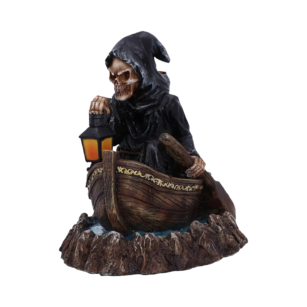 Figurine du passeur sur sa barque, lanterne à la main