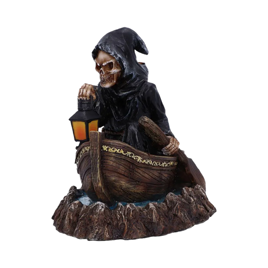 Figurine du passeur sur sa barque, lanterne à la main