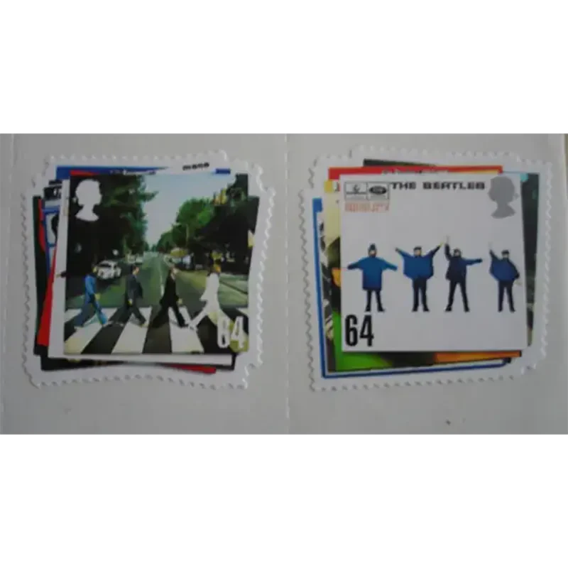 Gros plan sur les timbres Beatles – design Abbey Road et Help.